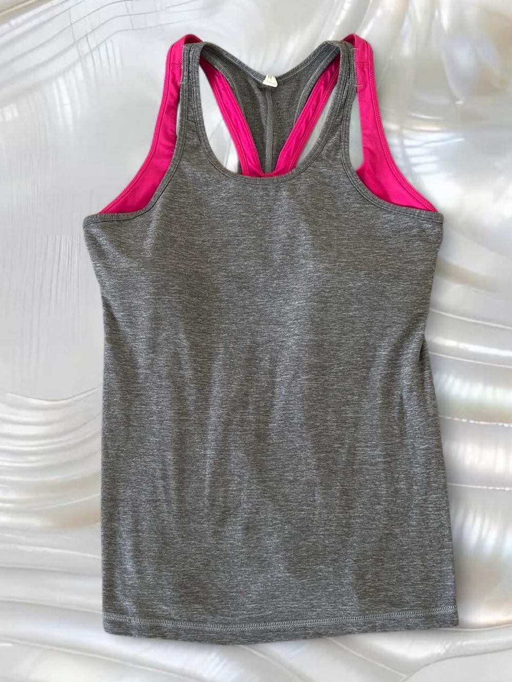 grey + pink lululemon tank top with built in sports bra